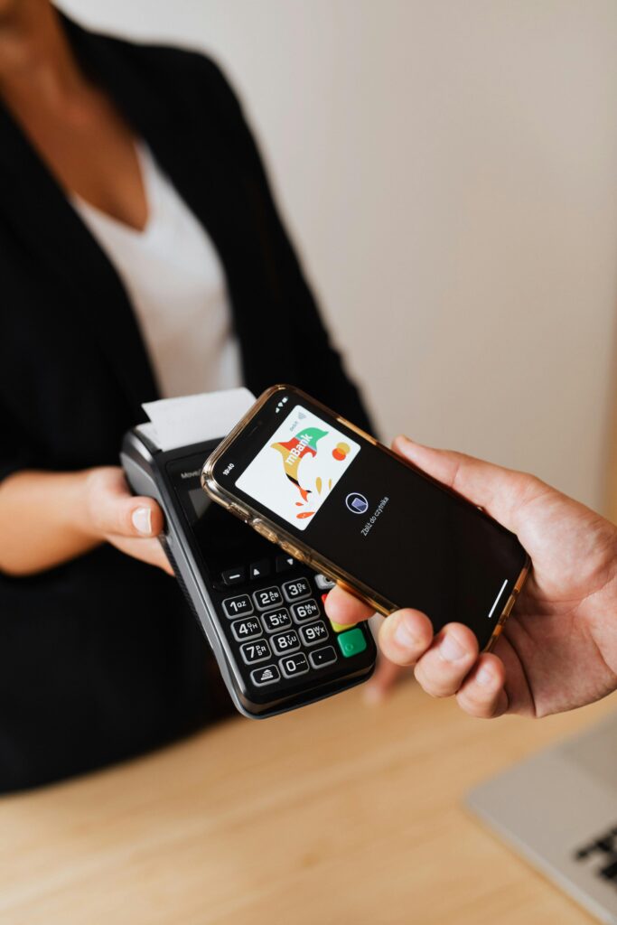 Modern POS terminal accepting contactless credit card payment for business payment processing